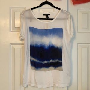 White shirt with blue design on front